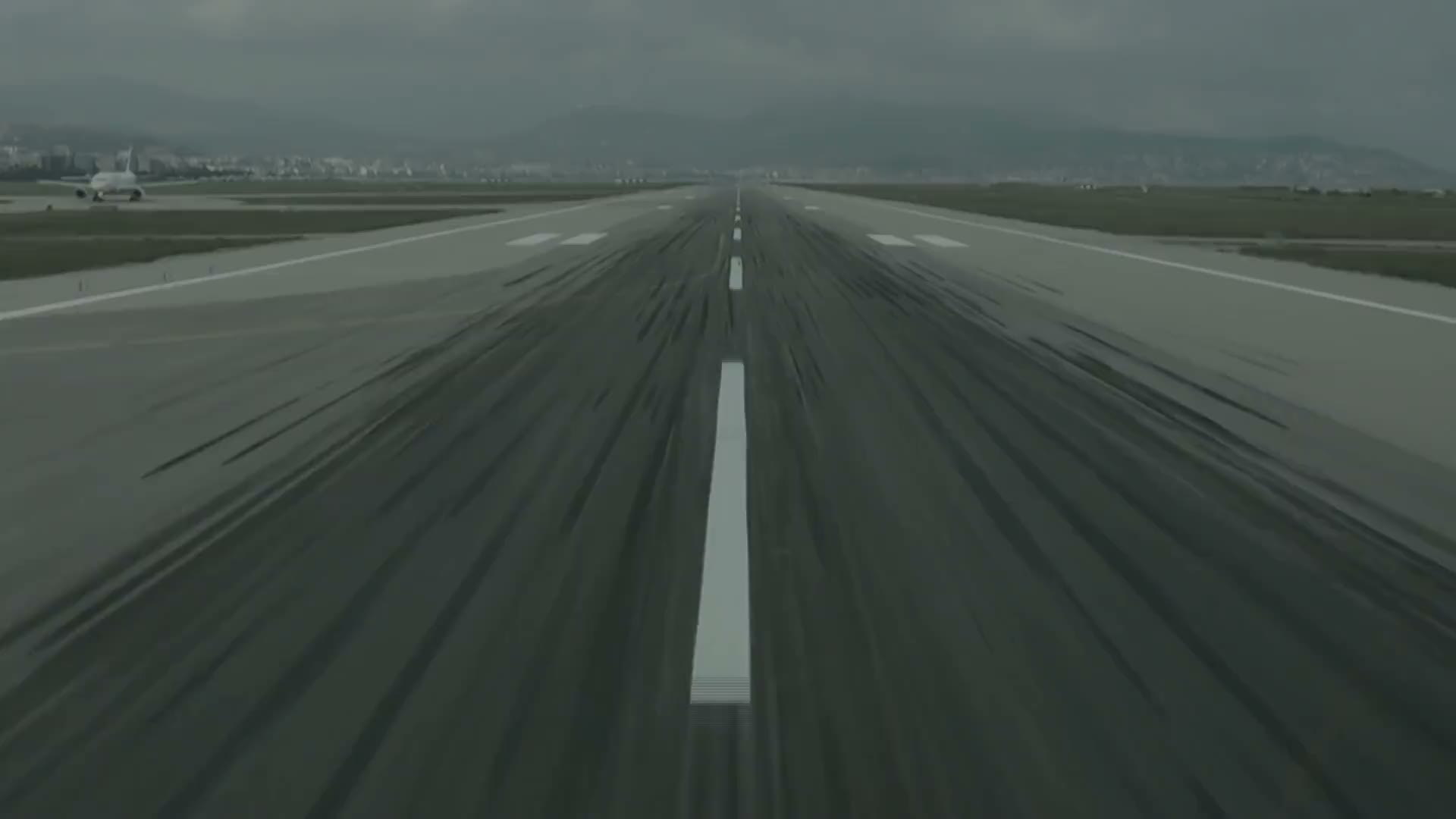 The view down a runway from the cockpit at the start of a takeoff roll